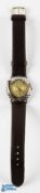 1986 F M Du Roy Golfers Wristwatch - the face and casing chased in the shape of a golf ball c/w golf