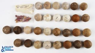 29x Assorted early rubber cored golf balls some with square dimples, lattice pattern and recessed