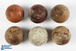 6x Early Golf Balls including an Orange covered round ringed patterned ball, 5x bramble patterns