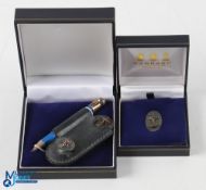 2003 PGA Cup Matches Silver Golf Set (2) - Garrard London Oval Silver Pin Badge in maker's case; and