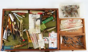 Collection of vintage fishing accessories including Spanguloid clipper and other lures, cork and