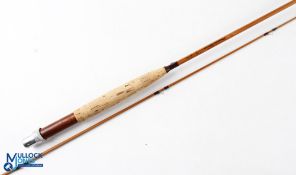 A 7' 2 piece impregnated split cane fly rod, butt section marked 