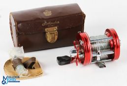 ABU Ambassadeur 6000 multiplier reel in red finish, foot stamped 057002 with star drag, counter