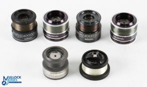 A selection of fixed spool spare spools as follows: 2x Daiwa Procaster Evo 3008A; 2x Shimano 4000;