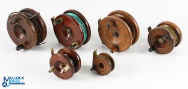 A collection of 7x brass/mahogany centre pin reels from 2