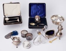 A mixed lot to include two silver napkin rings, 3.06oz, silver fabric lined pot, 1.31oz, silver shoe