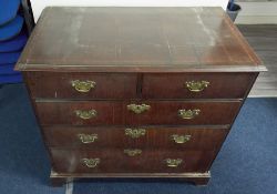 A Georgian mahogany and inlaid chest fitted with two short and three long drawers on bracket feet