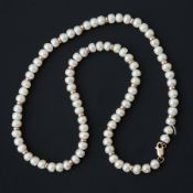 A string of freshwater pearls with 9ct yellow gold spacers & clasp, approx. 17