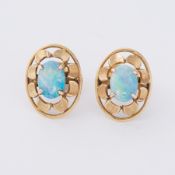 A pair of yellow gold (not hallmarked or tested) oval 'flower' style earrings set with a central