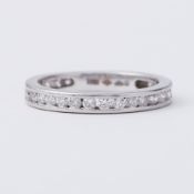 A platinum eternity style ring set with round brilliant cut diamonds which go 3/4 of the way