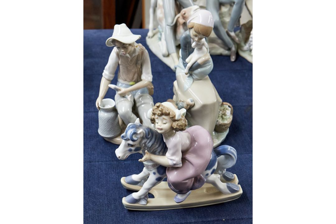 Two Lladro figurines including Girl on Rocking Horse and another but not marked (damaged) (3).