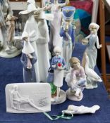 Six Lladro figurines, Lladro collectors society stand and another figure not marked (6).
