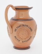 A Doulton Lambeth jug with inscription 'He that buys land, buys stones, He that buys flesh, buys