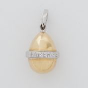 An 18ct yellow & white gold Faberge egg pendant, stamped Faberge, 6.89gm, length including bale