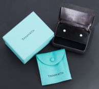 A pair of Tiffany & Co platinum 'Diamonds by the Yard' stud earrings by Elsa Peretti, rub-over