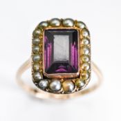 A rose gold Georgian amethyst & seed pearl ring, the central rectangular cut amethyst, measuring