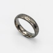 A platinum engraved leaf patterned wedding band, size P 1/2, 5.18gm.