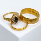 A 22ct yellow gold wide wedding band, 8.14gm, size X, a 22ct yellow gold wedding band, 3.91gm,