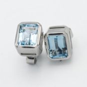 A pair of 18ct white gold emerald cut aquamarine designer stud earrings by Kojis.