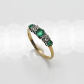 An 18ct yellow & white gold five stone half eternity style ring set with three square/cushion cut