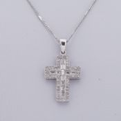 An 18ct white gold cross design pendant