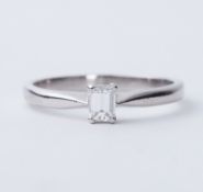 A platinum ring set with an emerald cut diamond, approx. 0.27 carats, approx.