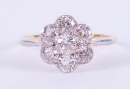 An antique 18ct yellow gold & platinum flower cluster ring set with approx. 1.27 carats