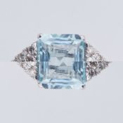 An 18ct white gold ring set with a central emerald cut aquamarine, approx. 4.70 carats