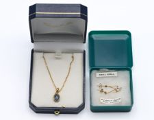 A 9ct pendant and chain set with opal together with a pair of 9ct opal earrings.