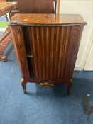 A French 19th century side cabinet with parquetry inlay, ormolu mounts and tambour door,