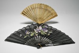 A carved bone fan, 19th century, finely carved and pierced with cash symbols and figures, the ends