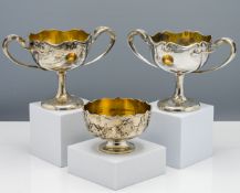 A pair of wine cups, each on a tall slender stem with a splayed foot, of rounded form with scalloped