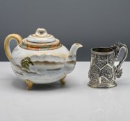 A small silver tankard, 19th century, the pear-shaped body finely decorated around the exterior in
