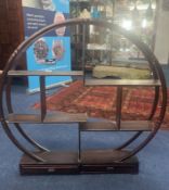A hardwood display stand, the almost circular frame on a rectangular base with two drawers and set