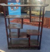 A Chinese damascened hardwood display shelf unit, 19th century. The asymmetrical arrangement over