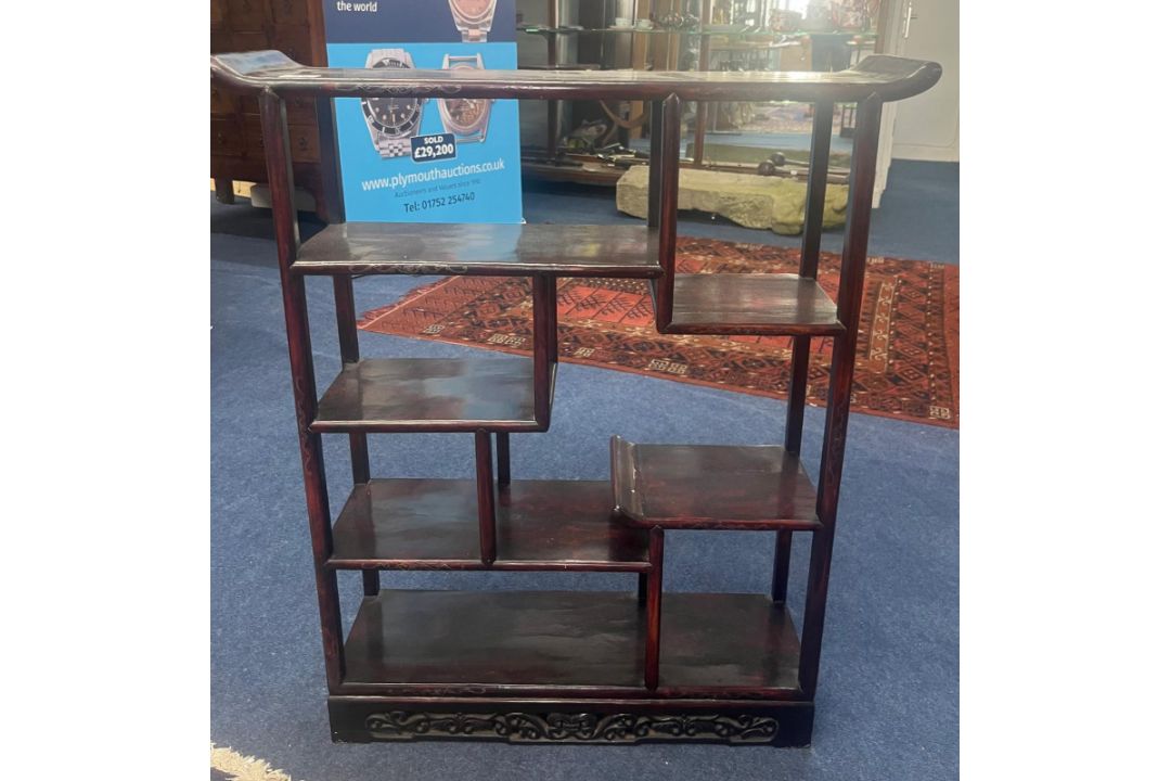 A Chinese damascened hardwood display shelf unit, 19th century. The asymmetrical arrangement over