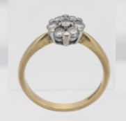 An 18ct yellow gold and diamond set cluster ring, size O.