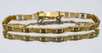 High-carat yellow gold open and bar link style bracelet with safety chain, probably 18ct, length