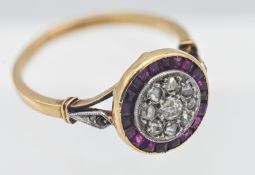 An Edwardian period ruby and diamond circle cluster ring size N.