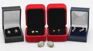 Five pairs of earrings to include pink and yellow sapphire diamond stud earrings.