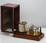 A barograph by Wilson Morden Company of London in mahogany case.