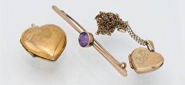 A 9ct heart shaped locket on chain, another locket and a 9ct amethyst set brooch.