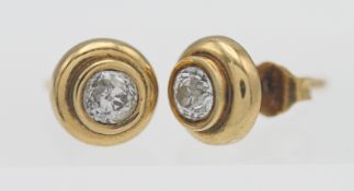 A pair of 18ct yellow gold and diamond stud earrings, approx. 0.20ct each.