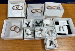 Swarovski Atelier, Collection of earrings to include, three pairs rose gold hooped earrings, one