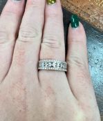 An 18ct white gold and diamond three row ring, size M.