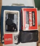 Imperial 203 portable typewriter w/instructions together with an Olympus Trip 35 boxed camera.