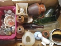 A mixed collection of vintage antique glass and stoneware bottles