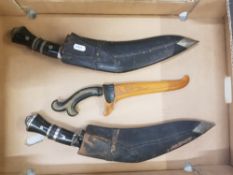 Nepalese Kukri Knifes grip wood and brass finish with miniature daggers together with carved