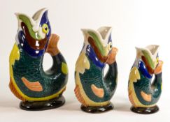 Wade graduated Gluggle jugs, tallest with hand written text to base, height 26.5cm. These items were