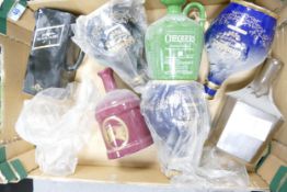 A collection of Wade Ceramic Whiskey & Spirit Bottles /decanters to include Glenfiddich, Chequers,